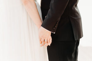 Couple holding hands at their predator ridge wedding