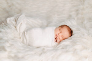 newborn baby wrapped in white, kelowna newborn photography