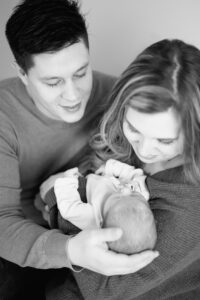 parents holding baby considering a kelowna daycare